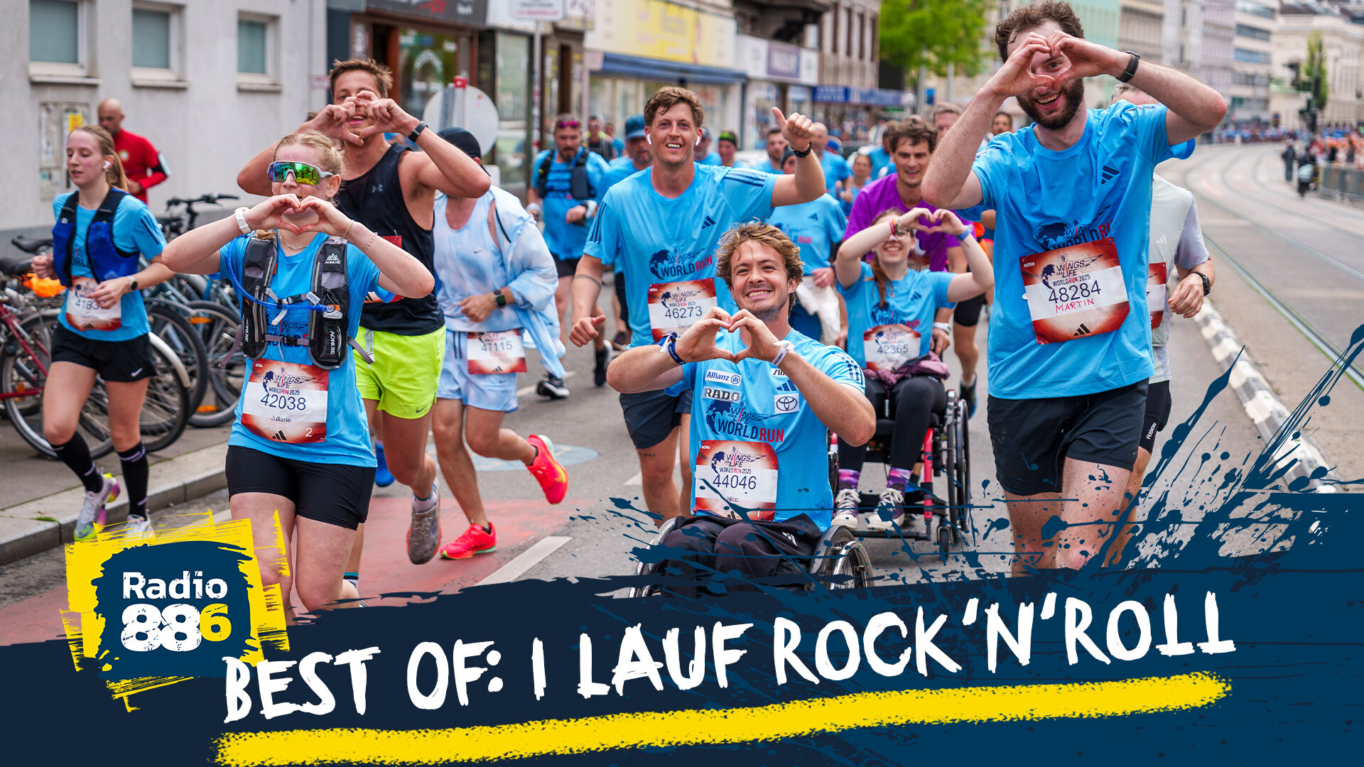 Läufer:innen und Rollstuhlfahrer:innen beim WFL World Run, die mit ihren Händen ein Herz formen